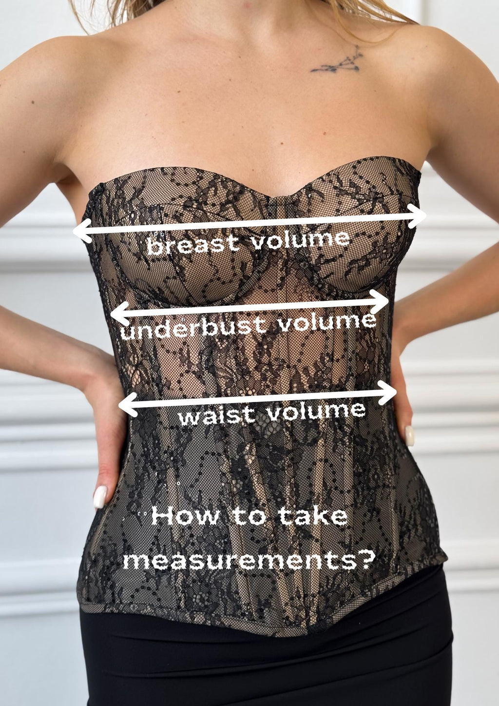 a woman wearing a corset with measurements on it