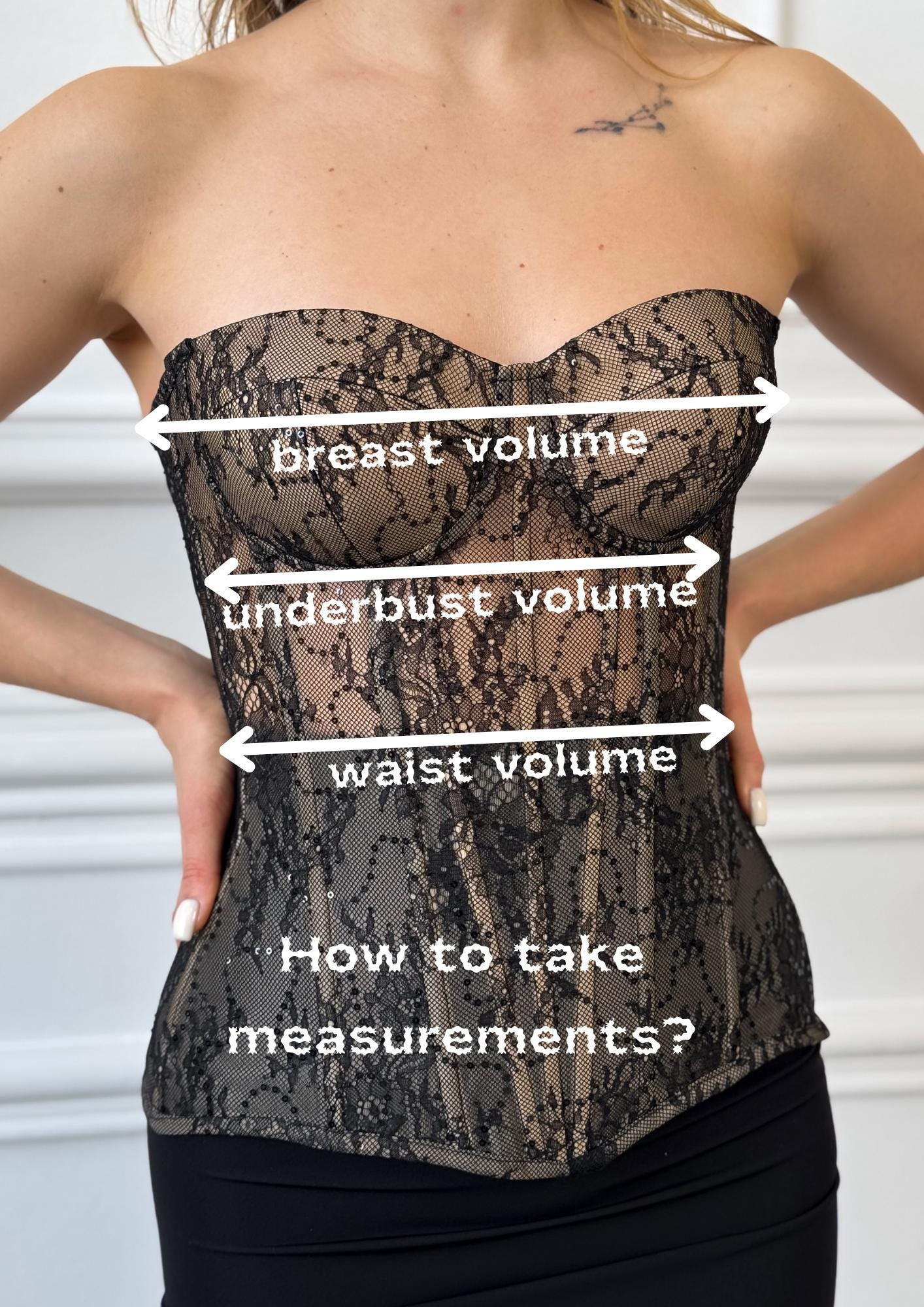 a woman wearing a corset with measurements on it