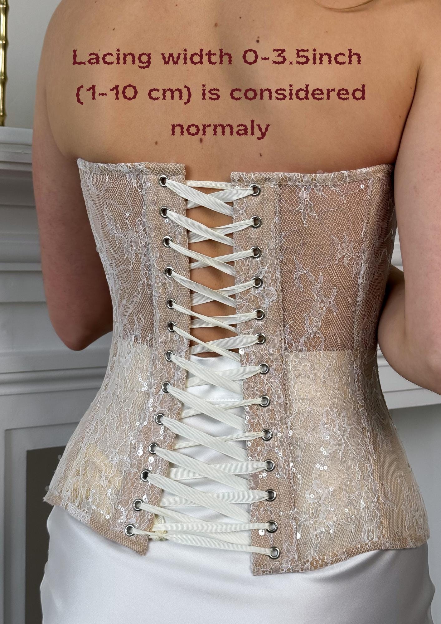 a woman wearing a white corset with lace detailing